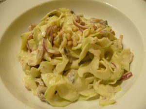 Delicious creamy pasta with mushrooms, red onion and nut cheese with fresh zucchini past....delicious!